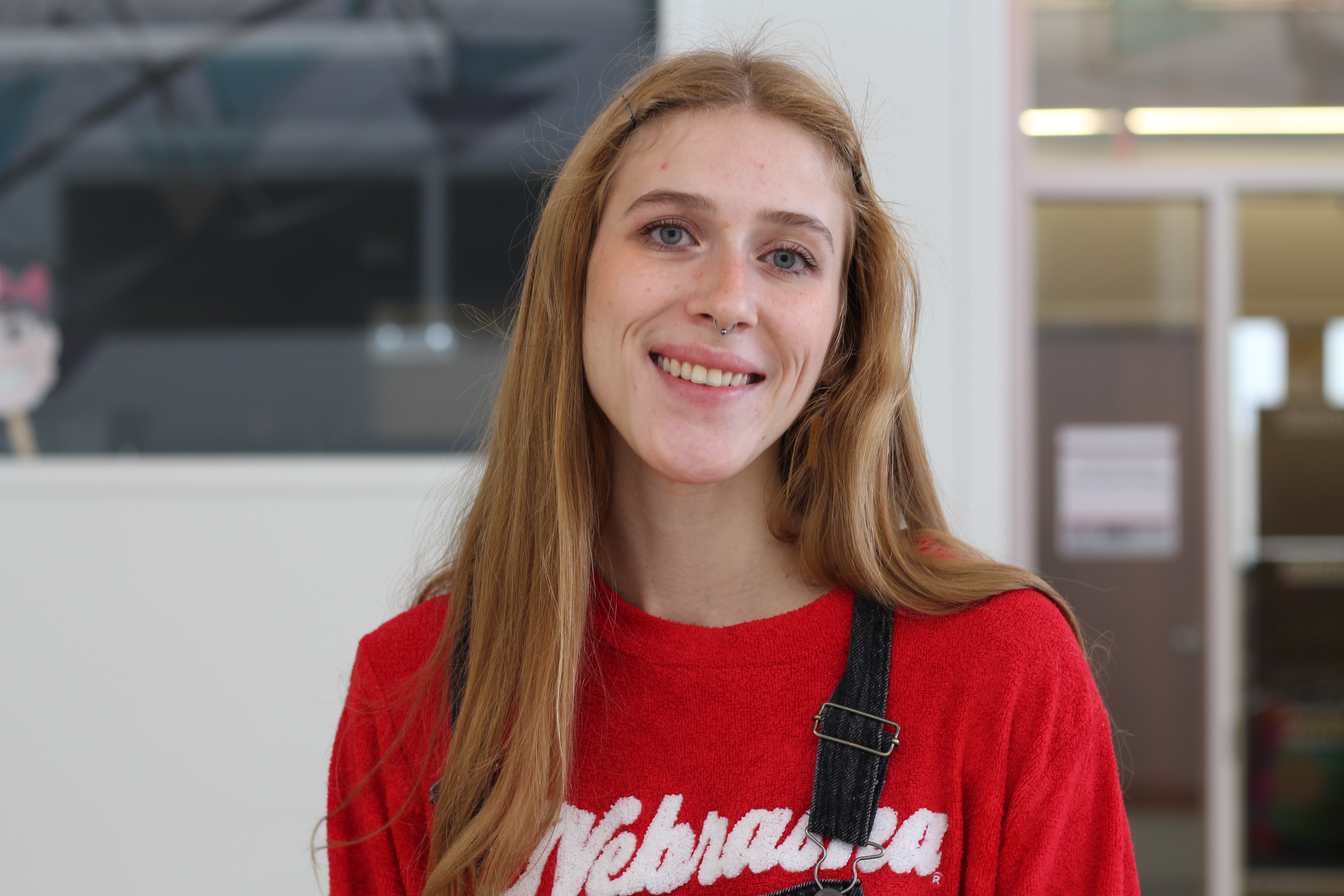 STEM CONNECT student posed for a picture, wearing Husker shirt