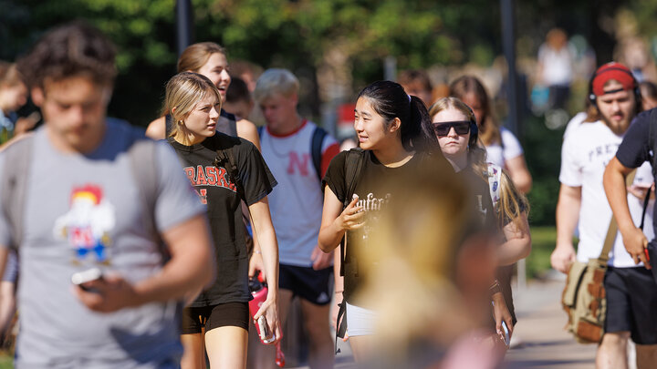 Brooklynn Hunke, a freshman from Gretna, Nebraska, talks with Misora Okuoka, a sophomore from Japan. The university’s latest census shows a 3.6% increase in first-time freshmen from Nebraska.