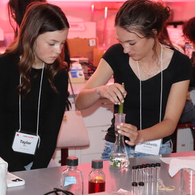 two girls doing science experiment