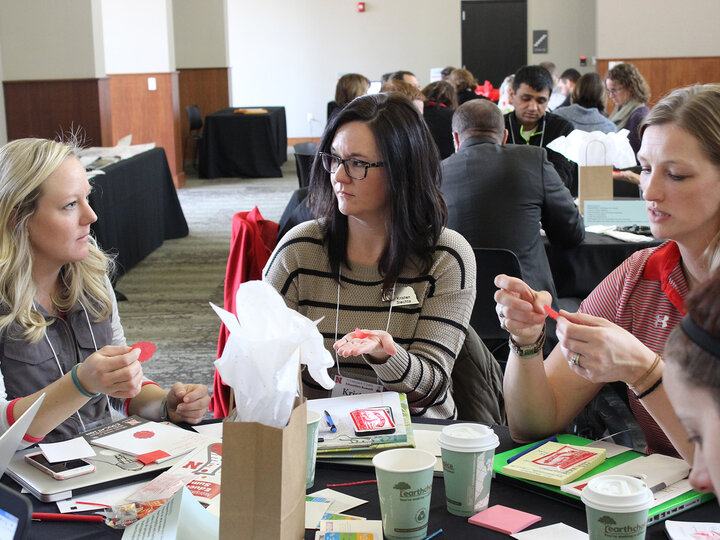 Teachers gathered working on project at summit