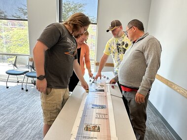 teachers doing physics experience with cars