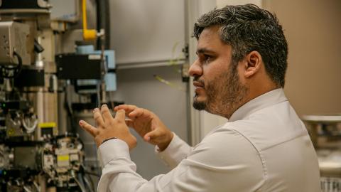 Eduardo Romero Camacho, research assistant professor of biochemistry and director of the CryoEM Core Facility, gives a laboratory tour during the May 6 grand opening.