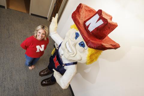 Ashley Dohe, Administrative Coordinator for Electrical & Computer Engineering, has make an 8-foot tall Herbie Husker from papier mâché.  She hopes to auction it off to help veterans.