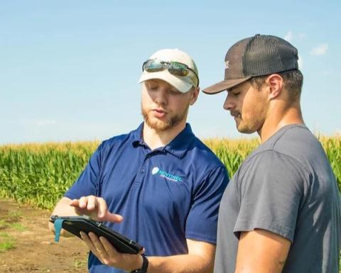Jackson Stansell (left) works with a client of Sentinel Fertigation. Stansell completed the Introduction to Customer Discovery course through NUtech Ventures in 2021.