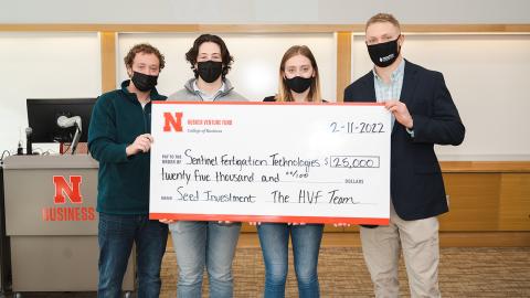 Members of the Husker Venture Fund awarded the first investment of $25,000 to Jackson Stansell, a biological systems engineering doctoral student at Nebraska. The HVF is a student-led venture capital fund that invests in Nebraska-owned early-stage startups. Pictured from left are students and managing directors of the fund Keith Nordling, Adam Folsom and Emily Kist, alongside Stansell.