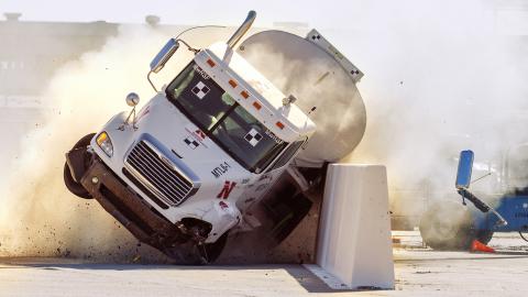 The roadside barrier developed by University of Nebraska–Lincoln researchers holds firm as a fully-loaded tractor-tanker vehicle slams into it during a Dec. 8 test.
